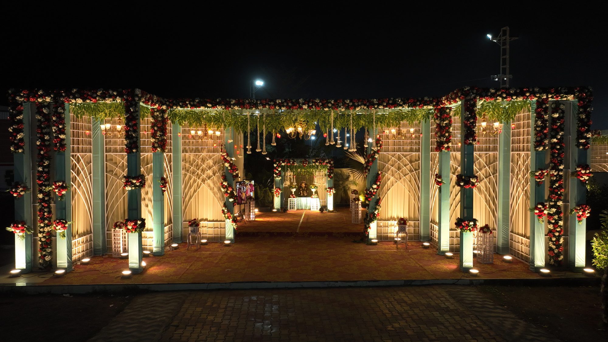 Illuminated wedding entrance at night